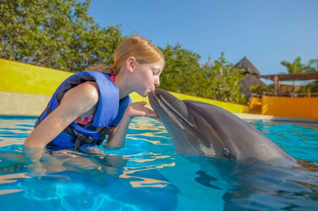 Kissing a Dolphin in Puerto Vallarta.