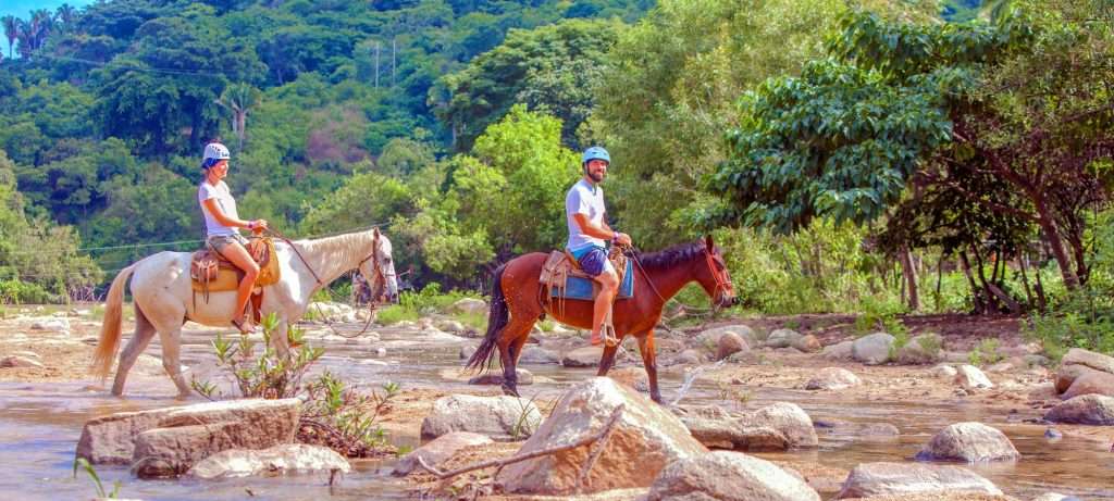 Horseback riders in Vallarta, Mexico