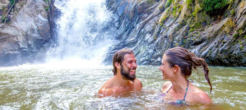 Couple at a Sea Safari waterfall in Vallarta, Mexico