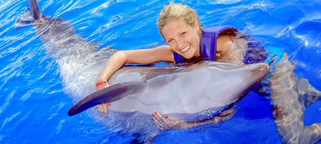 Hugging a Dolphin in Vallarta.