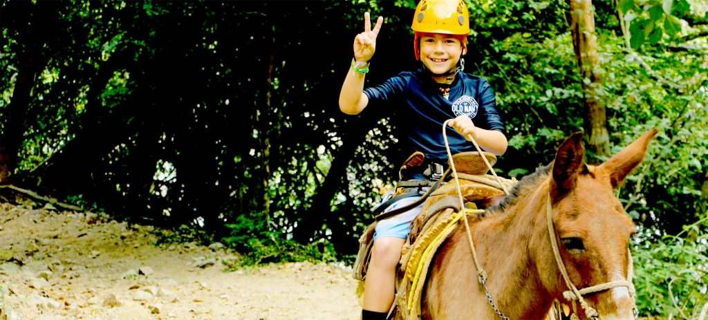Boy on a mule in Vallarta, Mexico