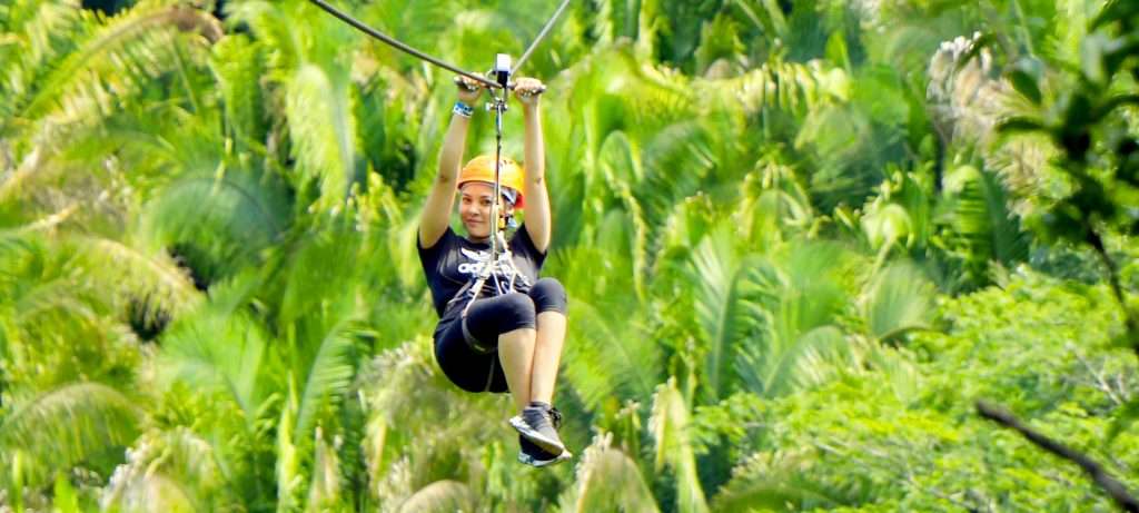 Cute girl Ziplining in Puerto Vallarta.