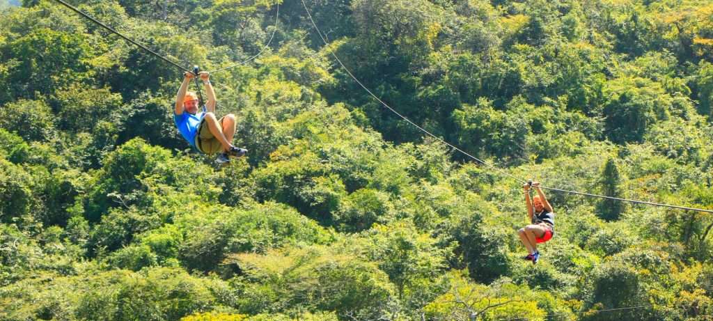 2 ride the zip lines in Vallarta, Mexico.