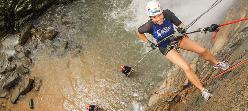 Lady rappelling in Vallarta.