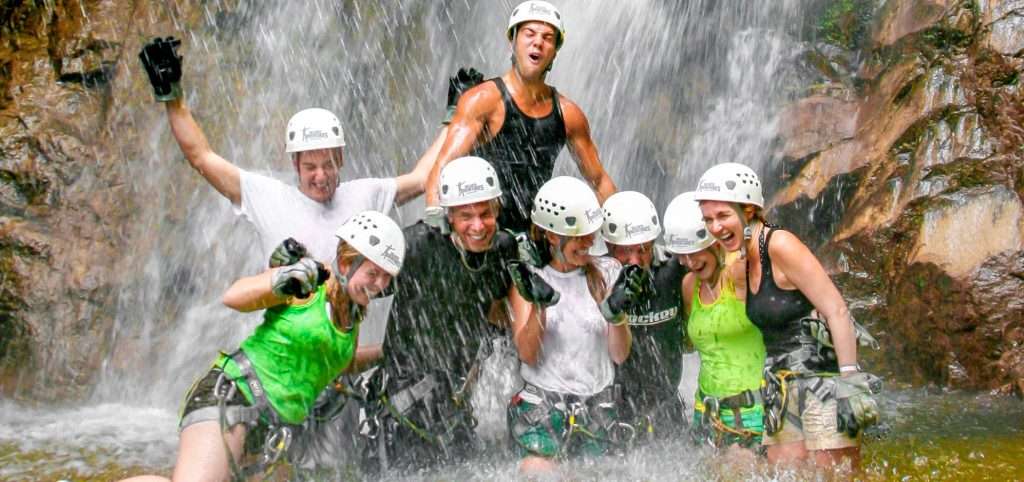 Wet group at waterfall in Vallarta.