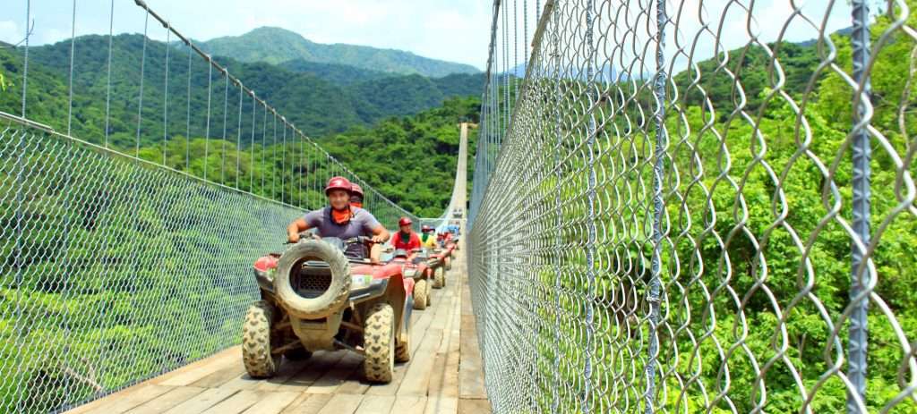 ATVs crossing Jorullo Bridge at River Canopy